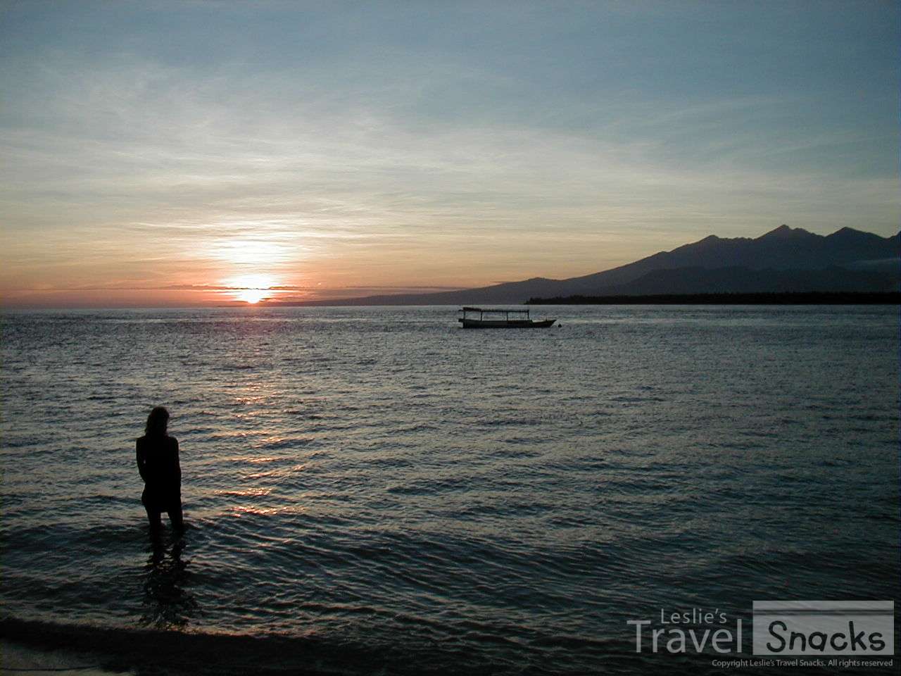 Me watching the sunrise from Gili Meno looking past Gili Air at Lombok.