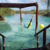 Relax in the hammocks at Los Rápidos, Bacalar, float down the canal, and enjoy some good eats.
