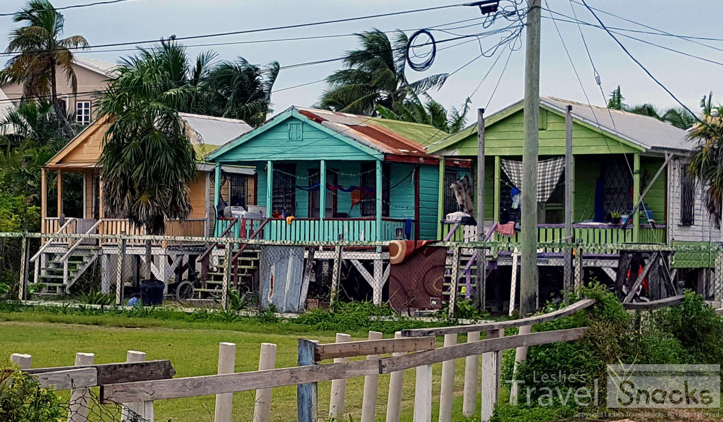 Colorful wooden houses on stilts speckle the countryside