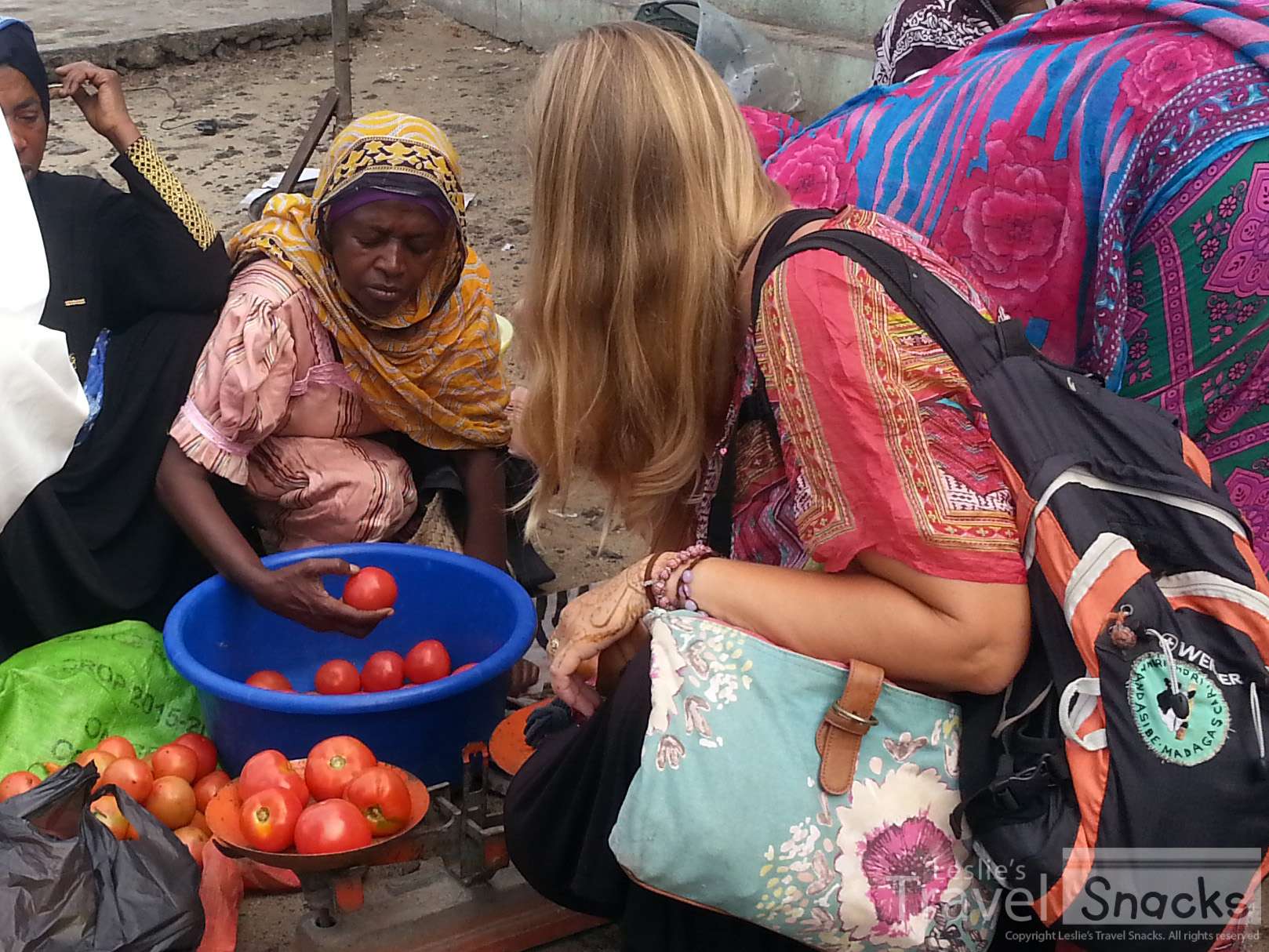 Haggling for a couple of kilos of tomatoes in Africa.